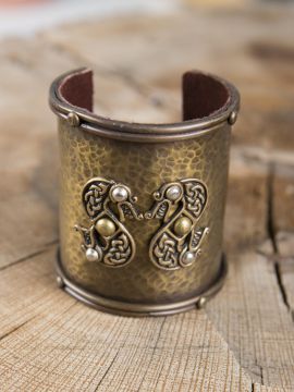 Wide brass bangle with Celtic snake motif