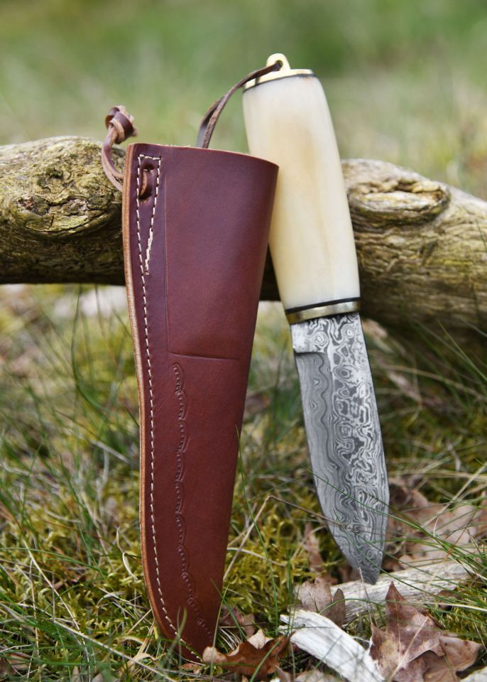 Utility knife made of Damascus steel with bone handle