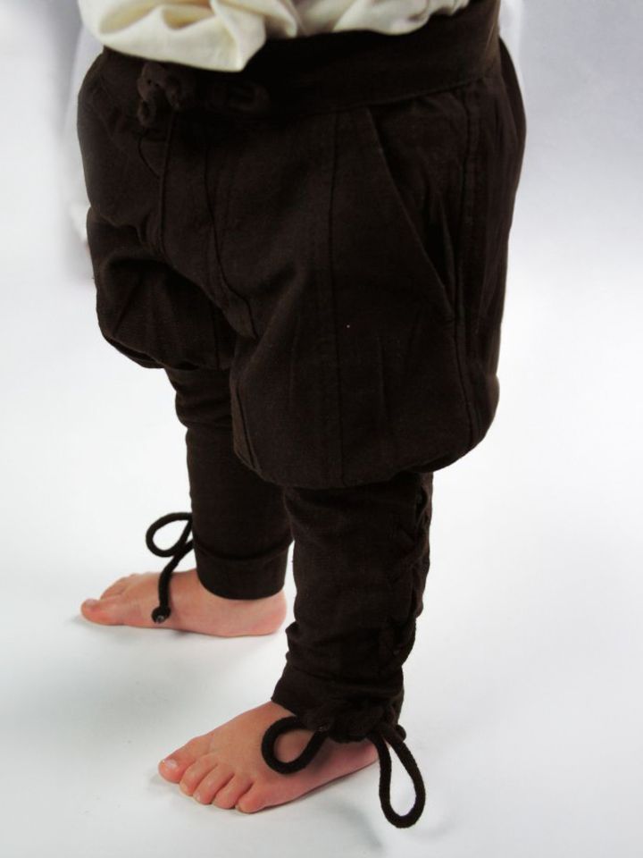 Children's trousers with brown leg lacing